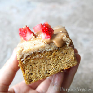 a slice of paleo pumpkin spice cake with almond butter frosting