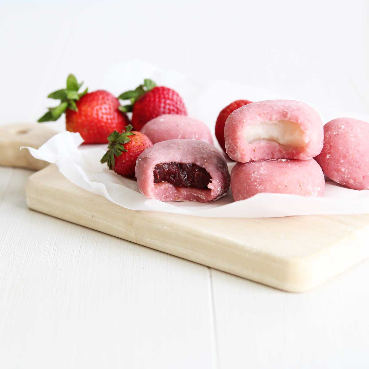 strawberry mochi with two different fillings - red bean paste and white bean paste