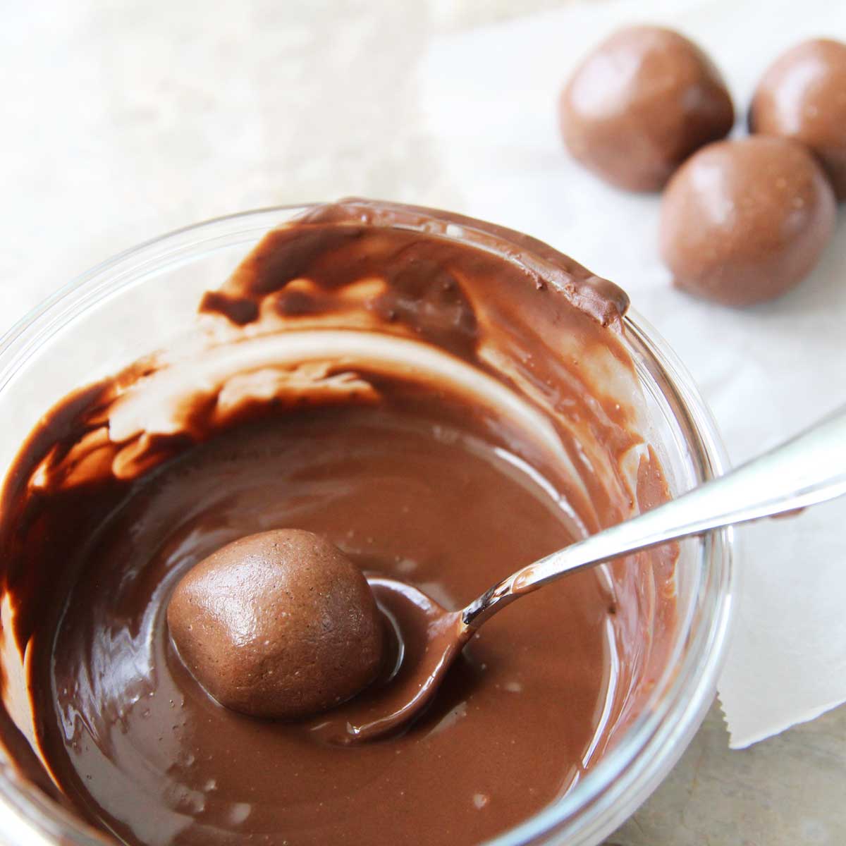 Dip the Nutella protein balls in melted chocolate