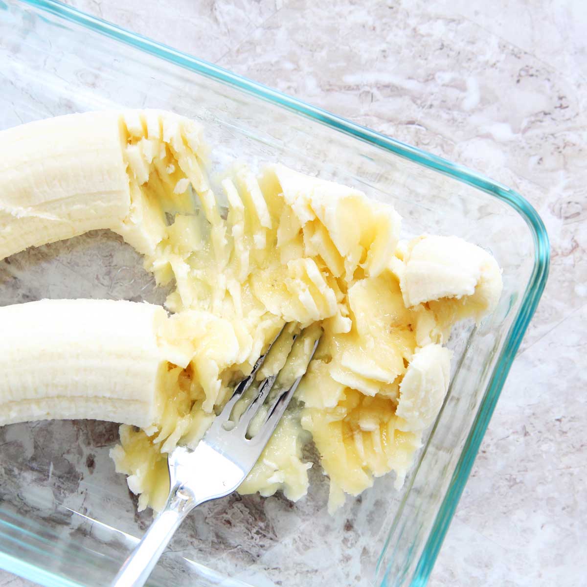 ingredient pic - mashed bananas with a large fork