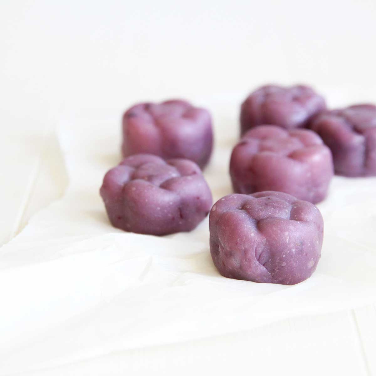 purple sweet potato ube snowskin mooncakes with ube filling