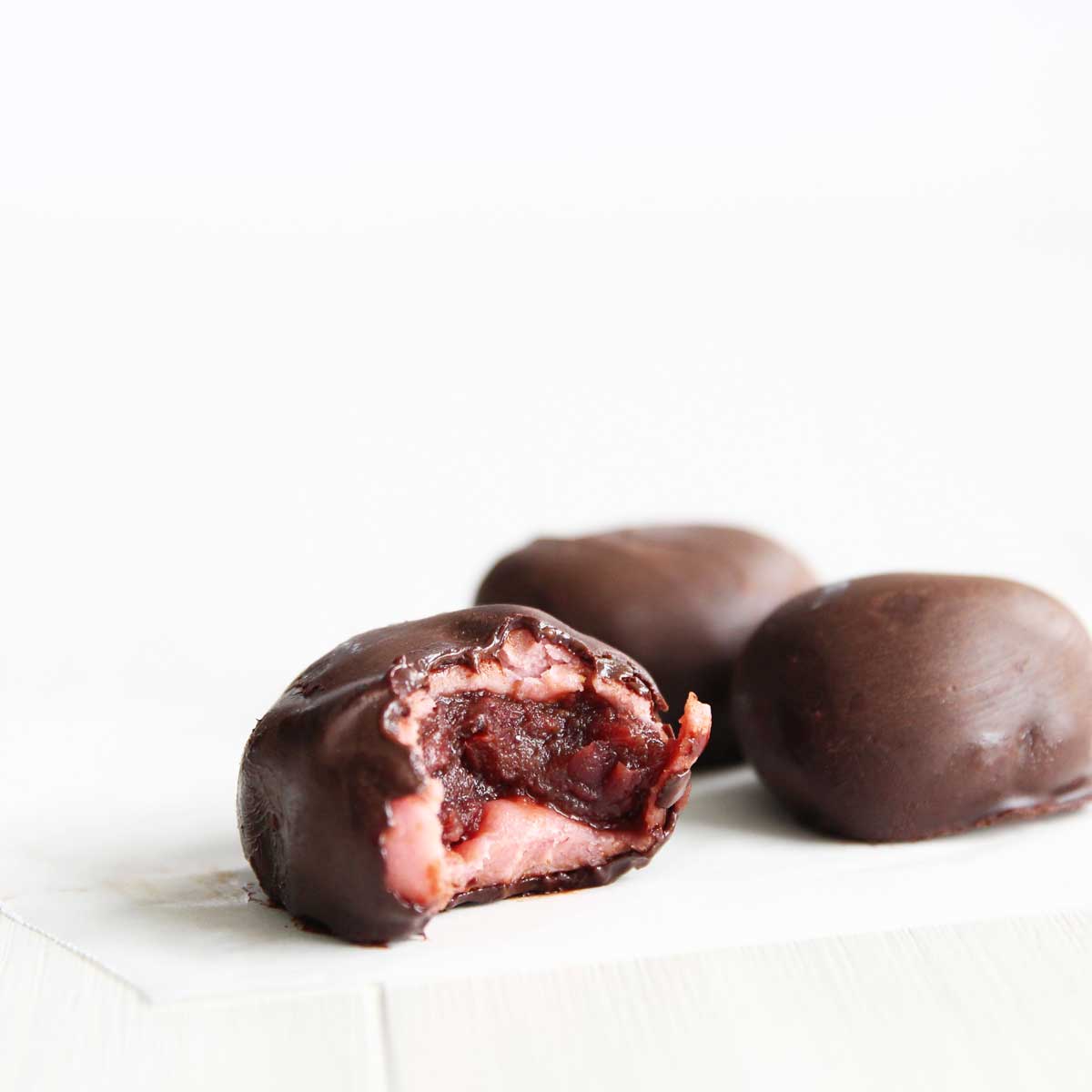 chocolate covered strawberry mochi with red bean paste filling
