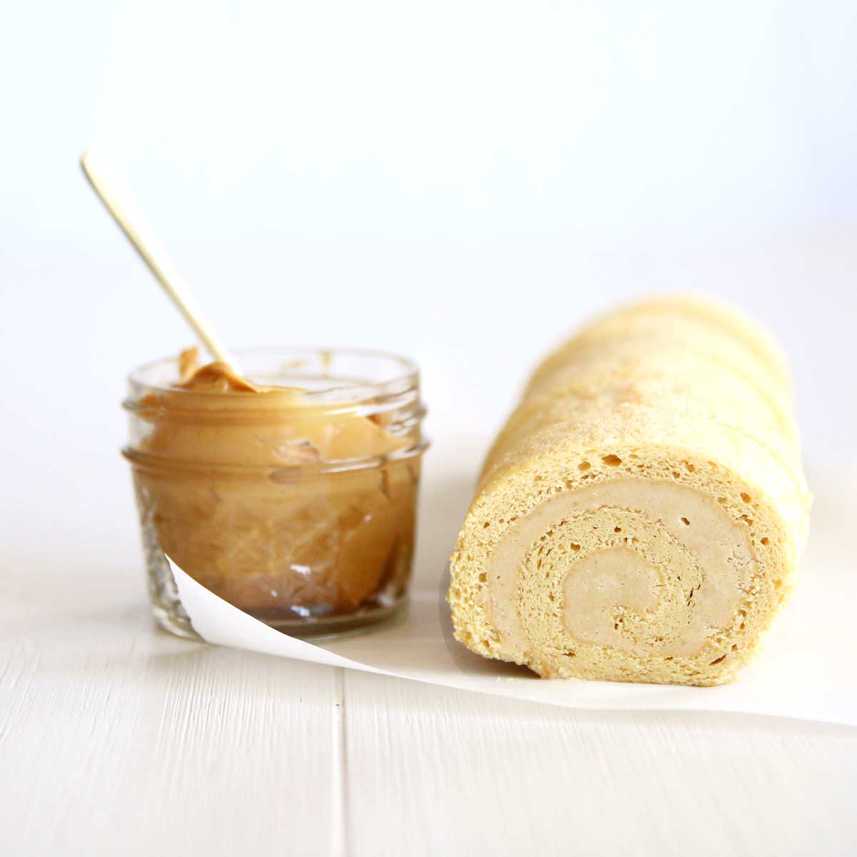 Flourless Peanut Butter Swiss Roll Cake with a Sweet Peanut Cream Filling - Peanut Butter Glaze
